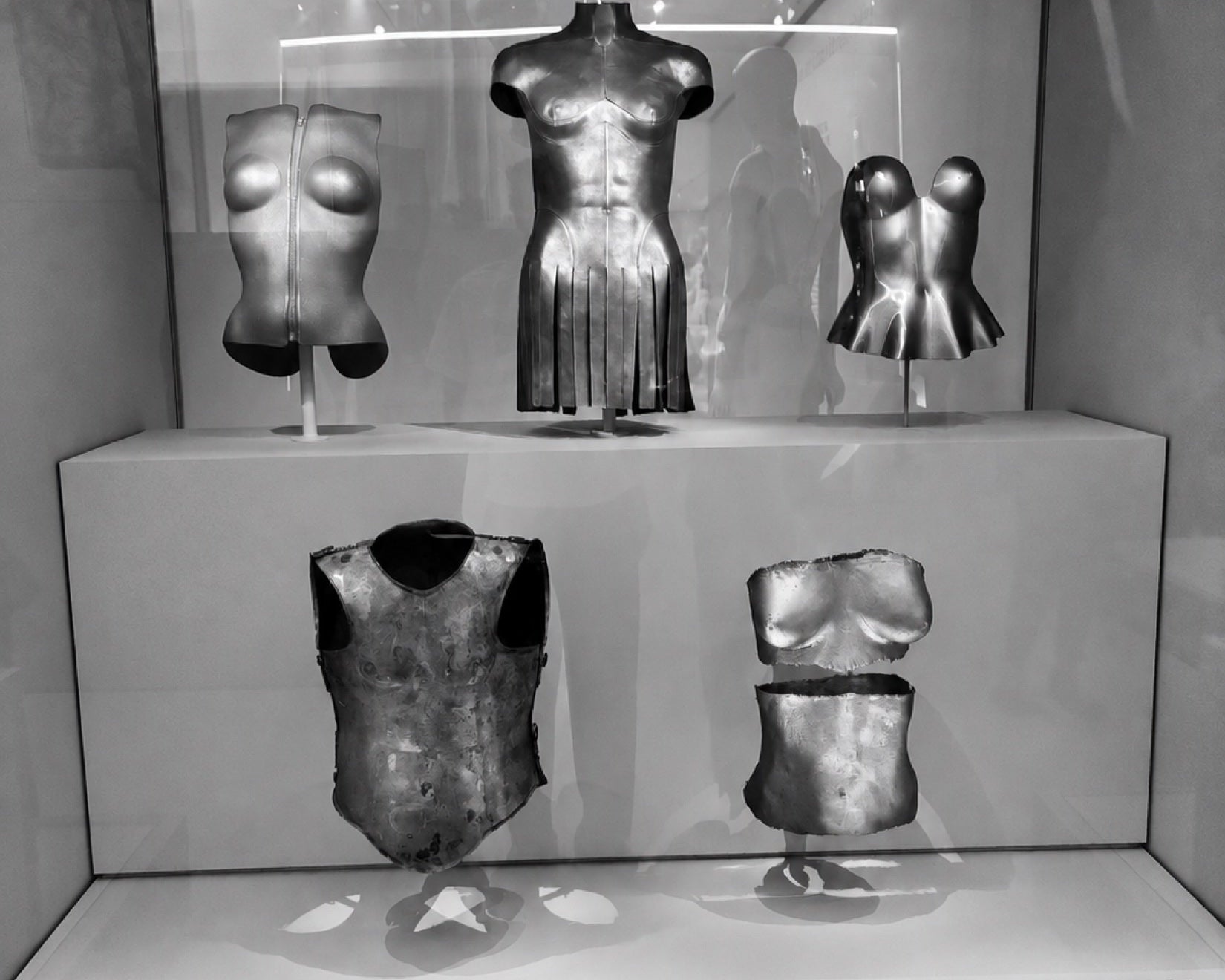 Museum objects and the practice of looking beyond a garment rail.