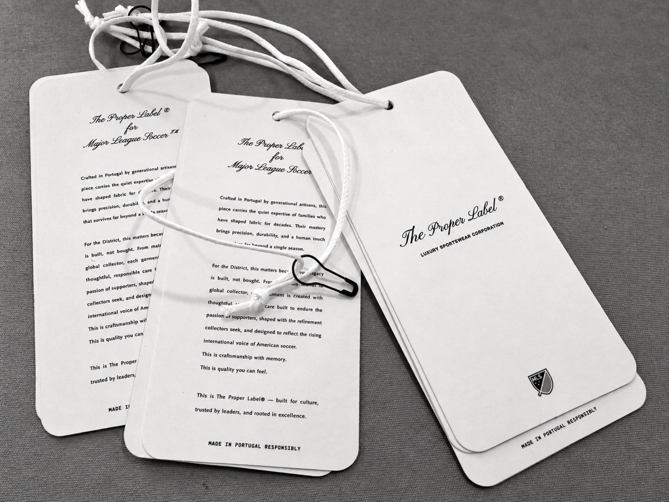 The small printed and woven pieces that accompany a garment.