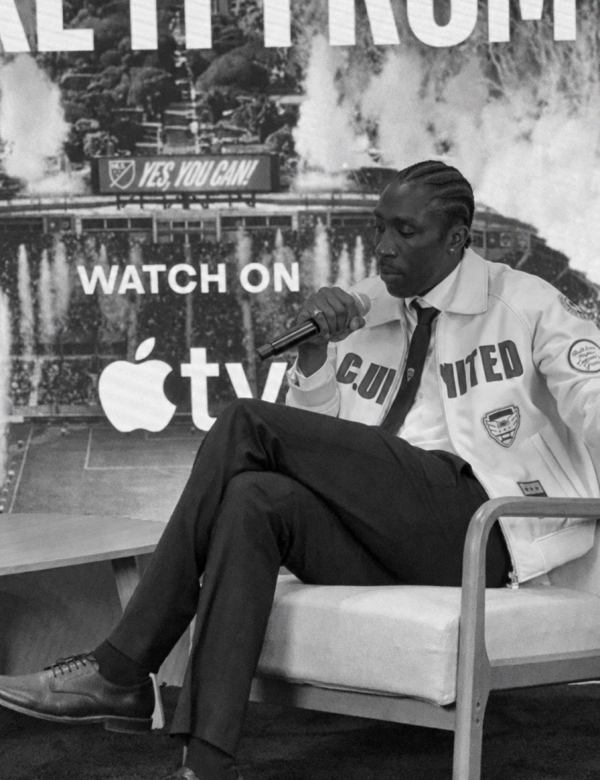 Camille Tanoh in conversation, with the club wardrobe close at hand.