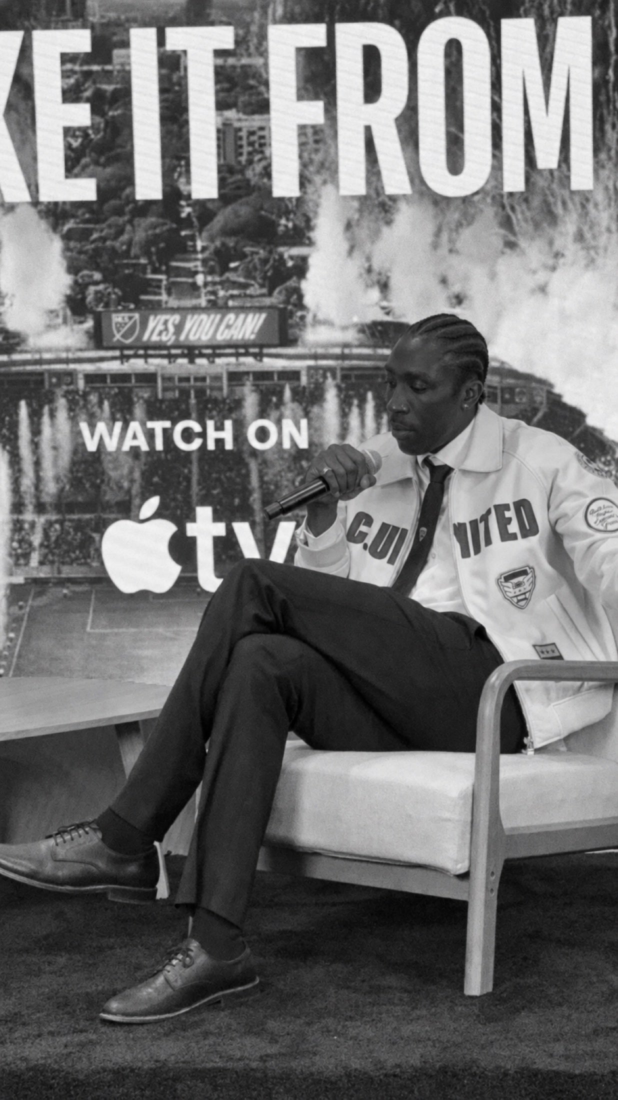 Camille Tanoh in conversation, with the club wardrobe close at hand.
