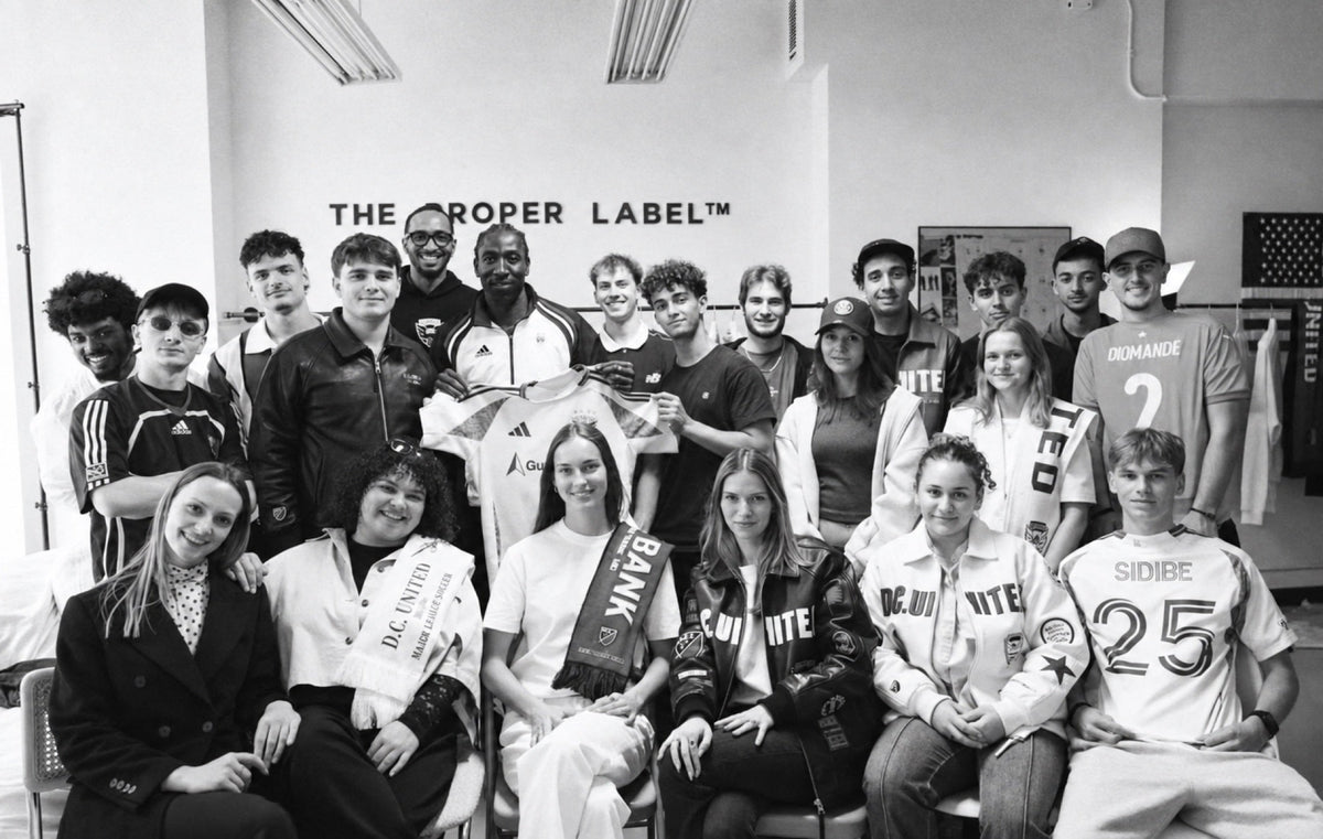 A group photograph, an open room and clothes that become a shared conversation.