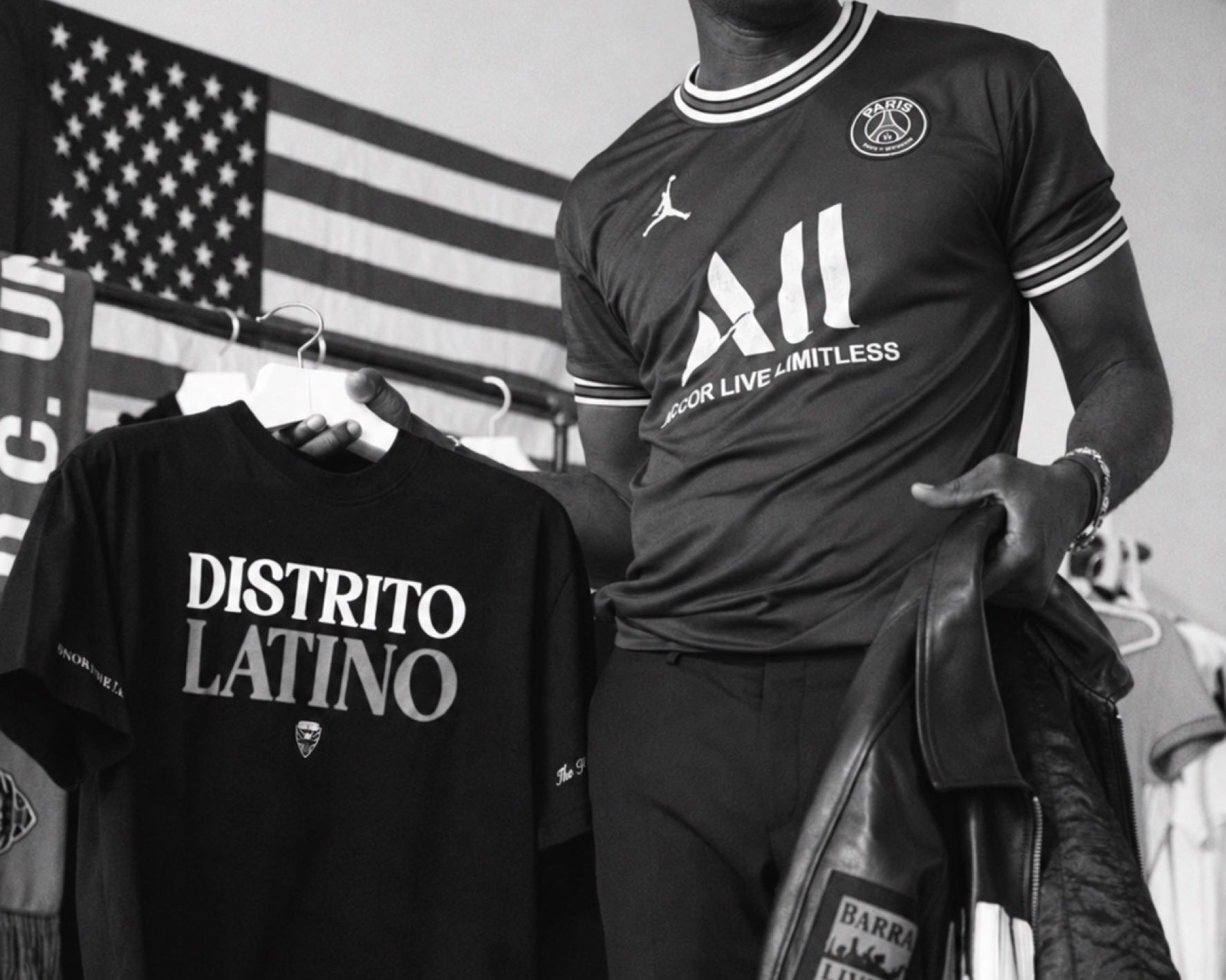 Club identity across a T-shirt, a hoodie, a scarf and a leather jacket.