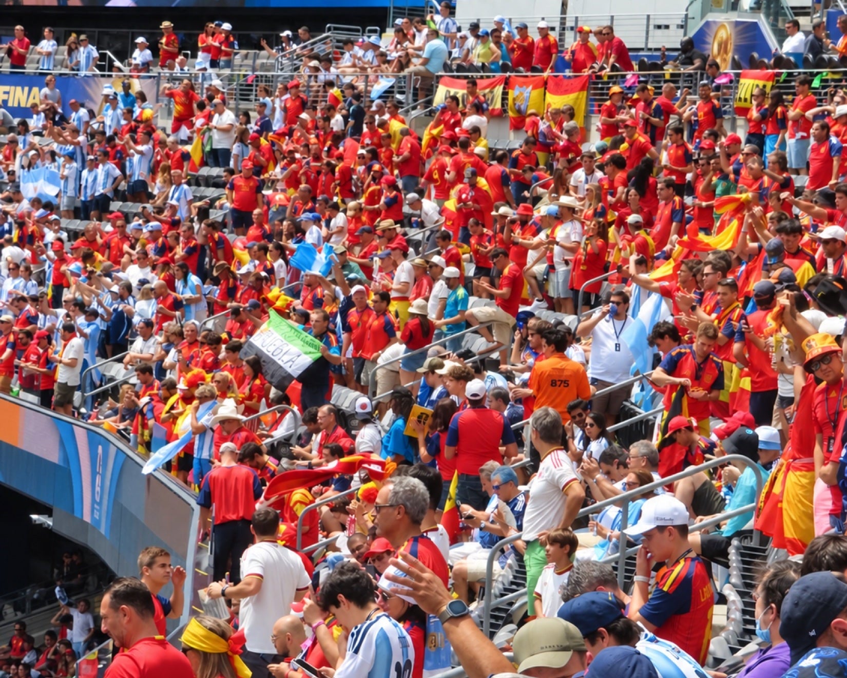 Red and sky blue meet in the crowd at the 2026 World Cup final.