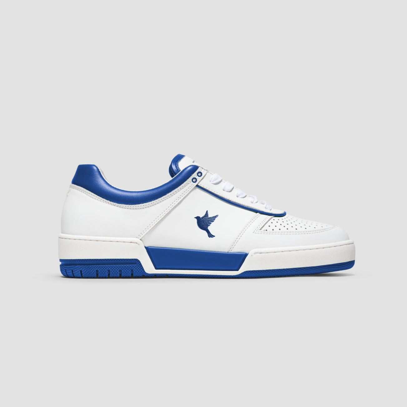 Sustainable sneakers made of durable with blue and white color accents, showcasing a 3D-printed dove emblem on the side.