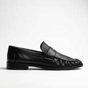Black loafers Moccasins on a white background
