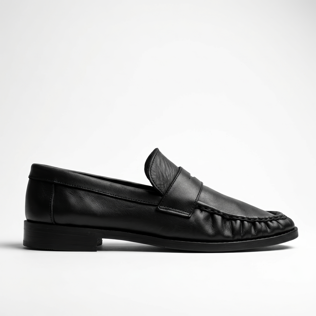 The Proper Moccasin, black leather loafers — side profile