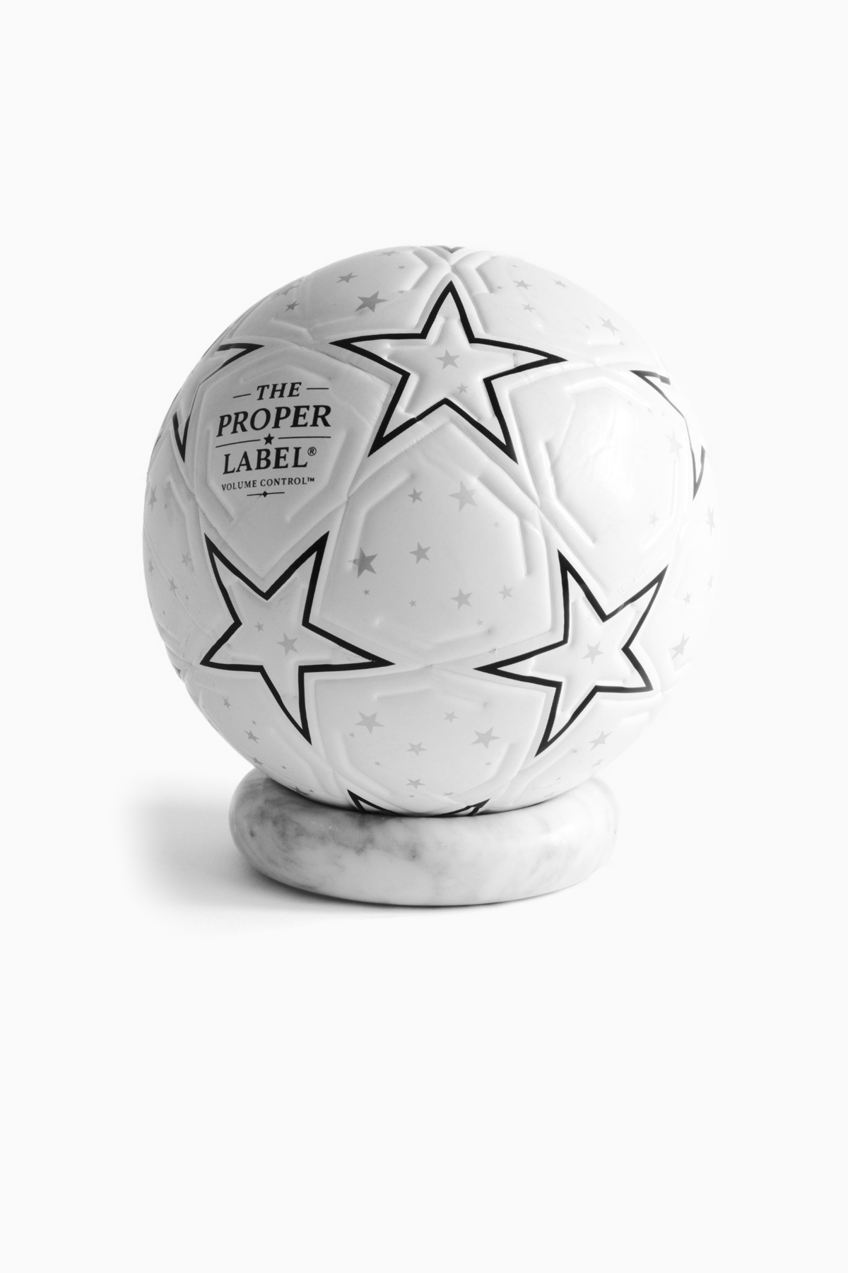 The Proper Starball — angled studio view on a marble stand.