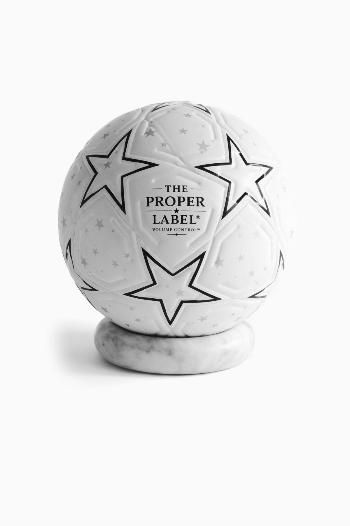 The Proper Starball — front studio view on a marble stand.