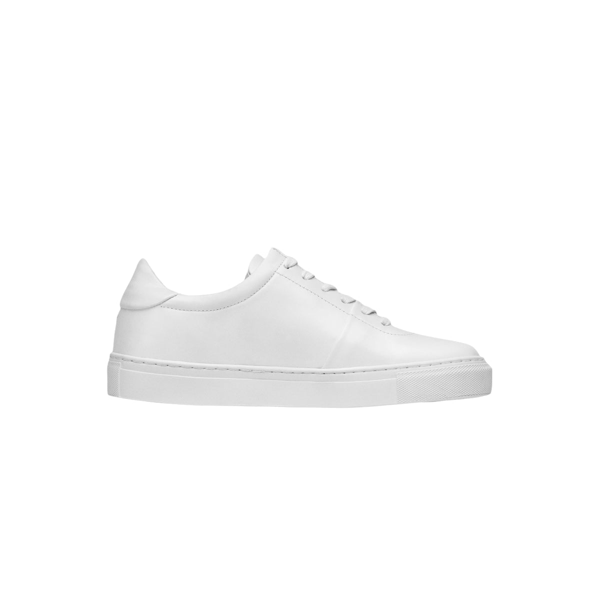 The Proper Sneaker® in white leather, seen in profile against a white background.