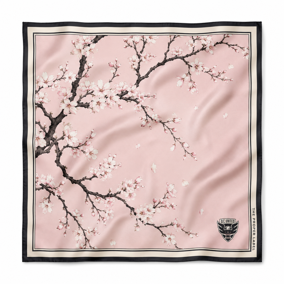 Concept visualization of the D.C. United Cherry Blossom scarf with pink blossoms and a black border.
