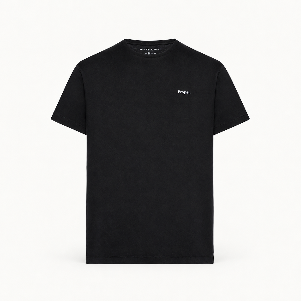 Essential T-shirt — black — single product view on the Maison studio background.