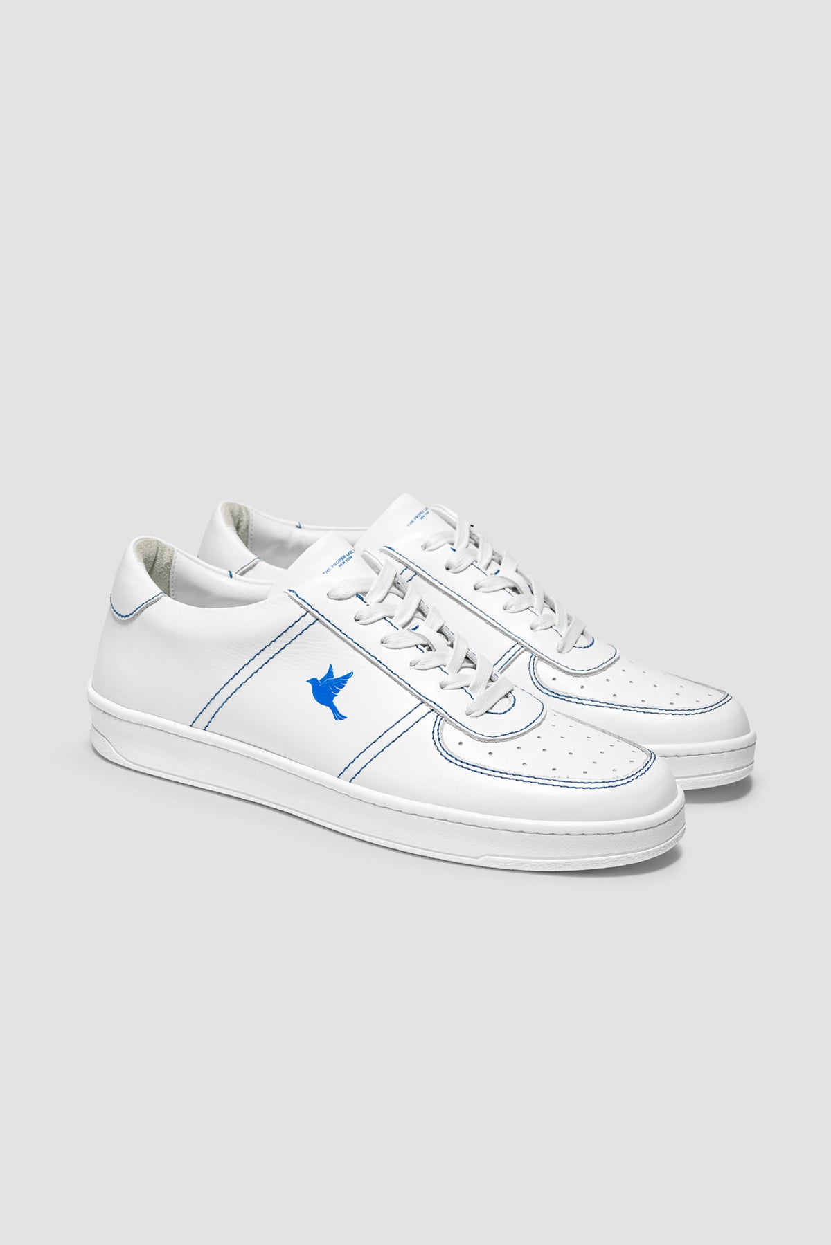 The Proper Fly Sneaker — White / Blue — studio view 02