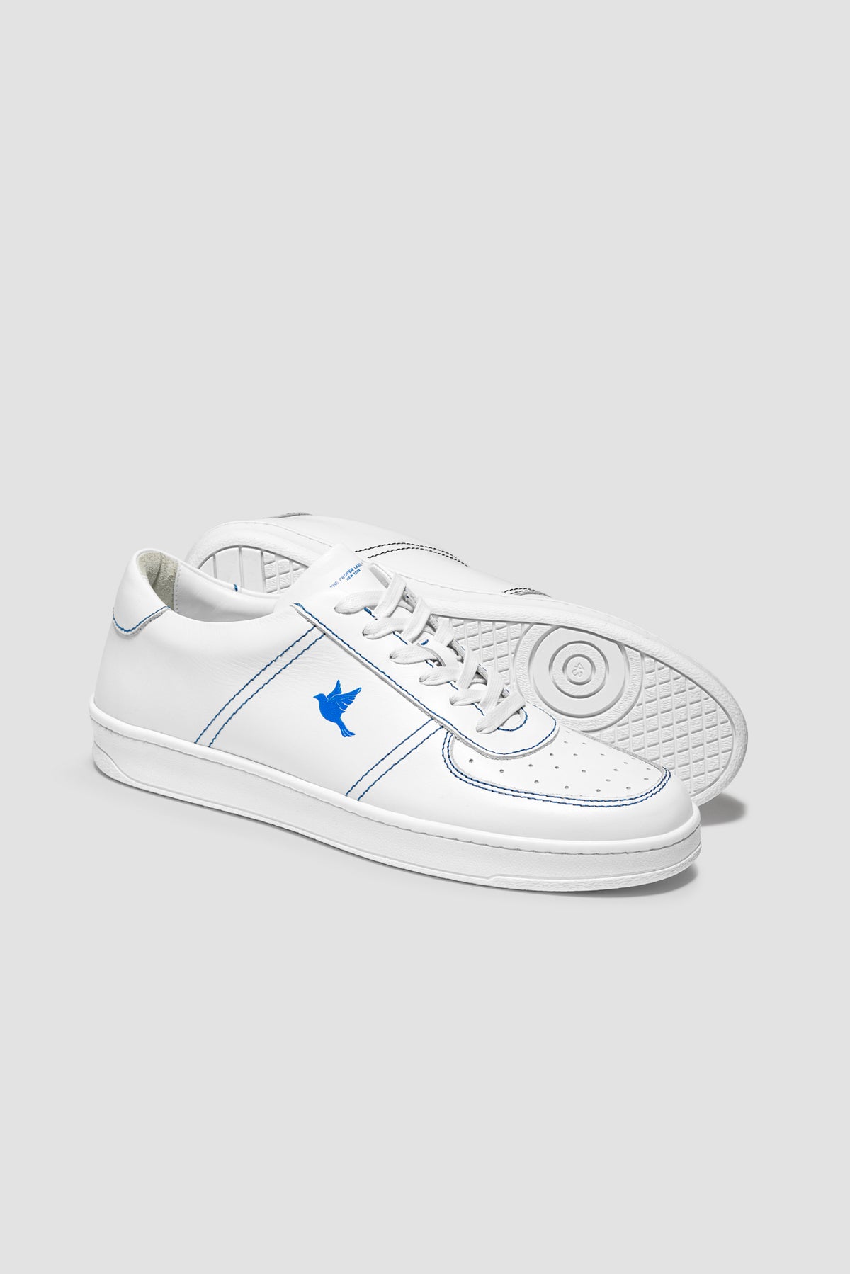 The Proper Fly Sneaker — White / Blue — studio view 04