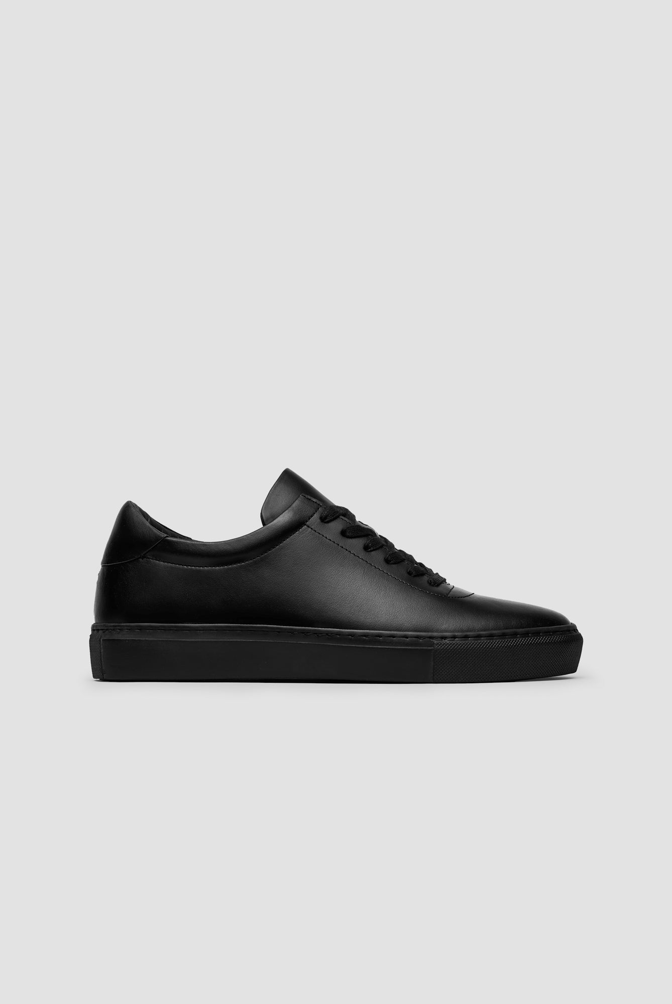 The Proper Sneaker — Black — studio view 01