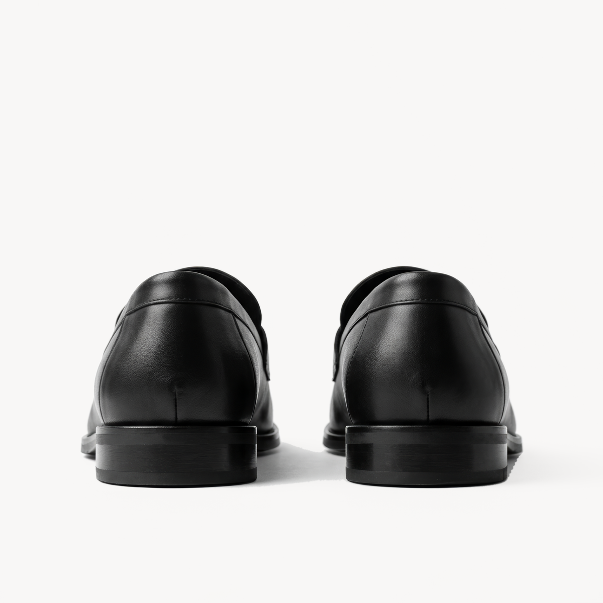The Proper Moccasin, black leather loafers — back of the heels