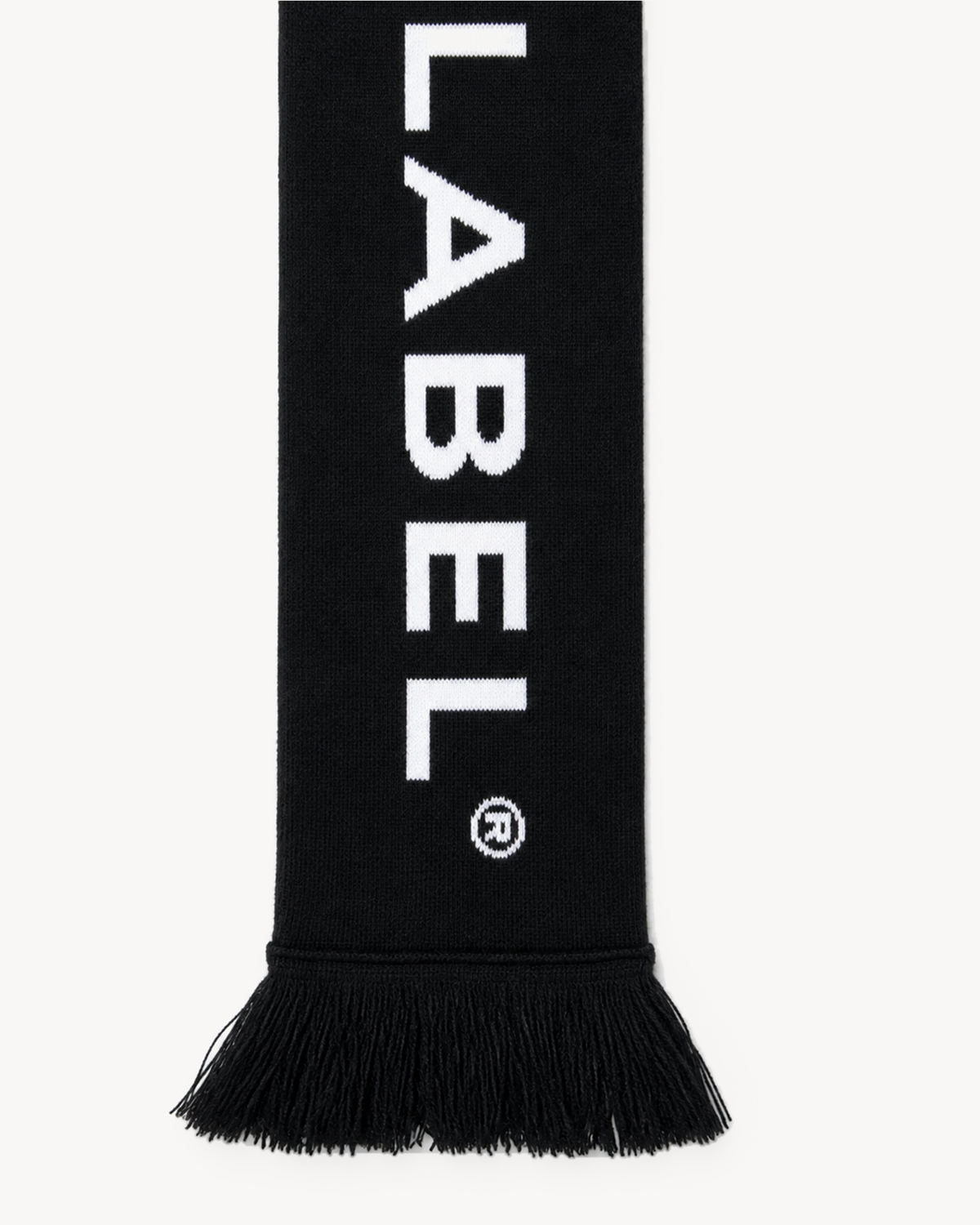 City Scarf — signature lettering and fringe detail