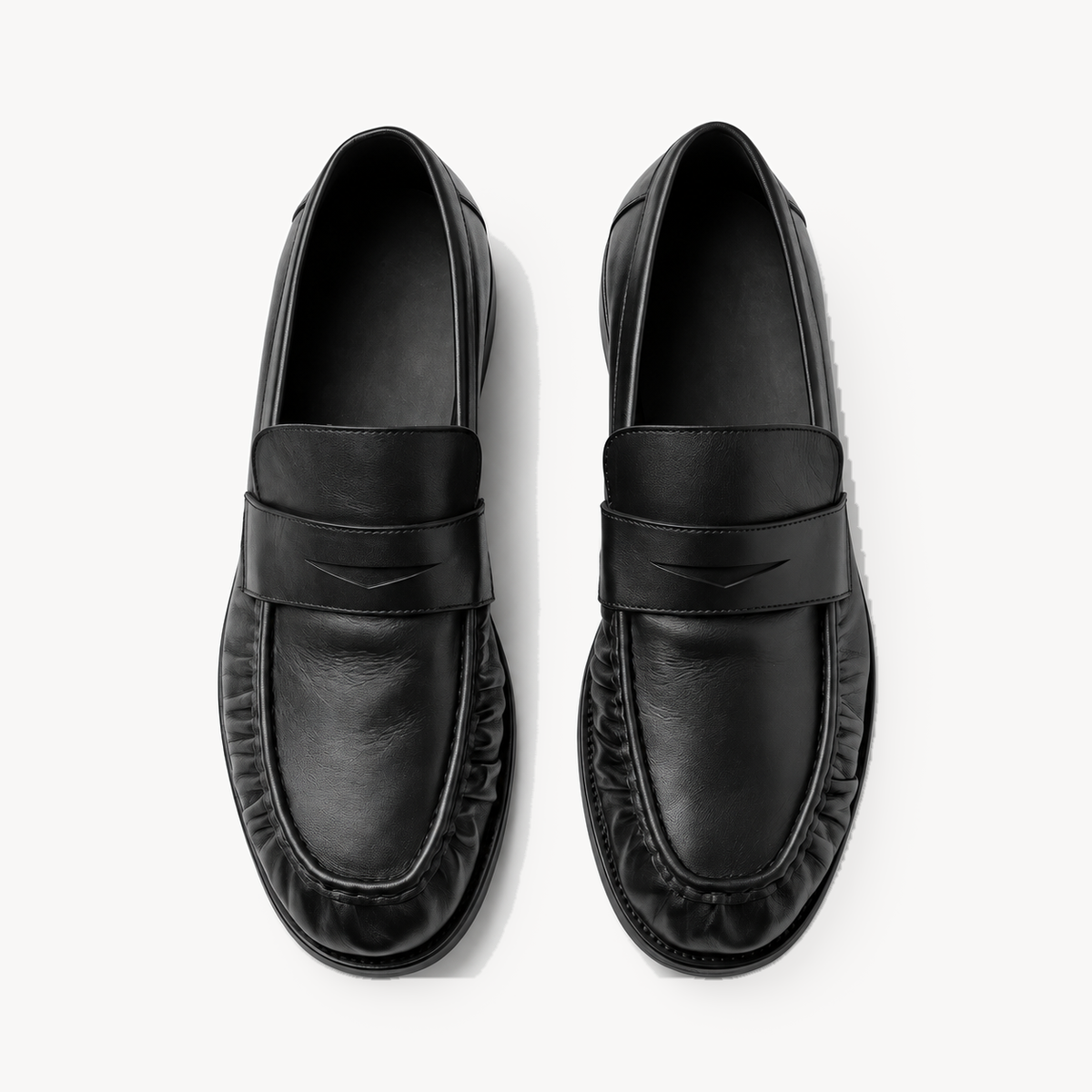 The Proper Moccasin® — Obsidian Black, overhead view of the V-cut saddles.