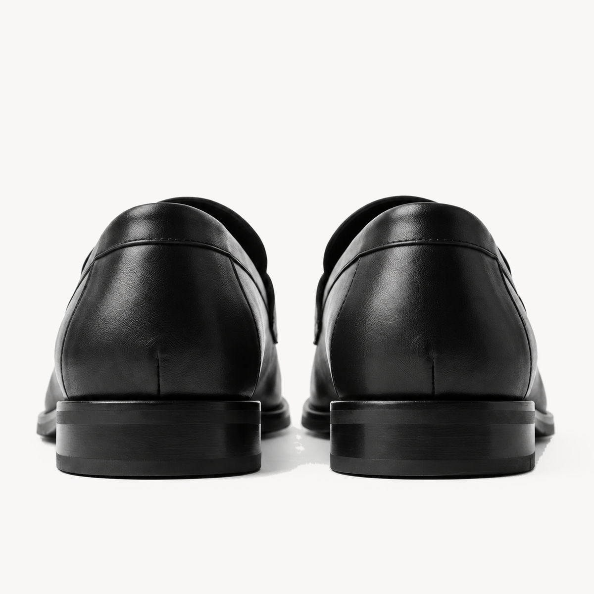 The Proper Moccasin® — Obsidian Black, heel construction.