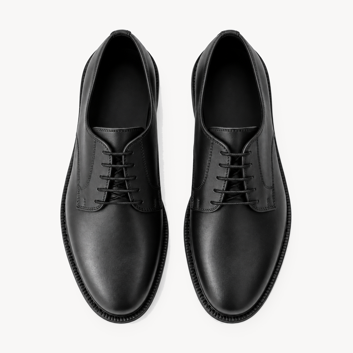 The Legacy Derby — pair viewed from above, five-eyelet lacing.