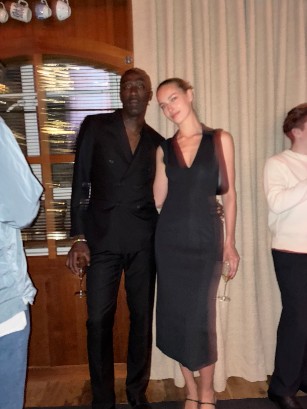 Camille Tanoh and Julia, photographed together at an evening gathering.