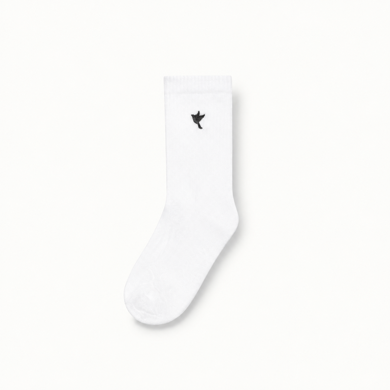 Dove socks — white / black — single product view on the Maison studio background.