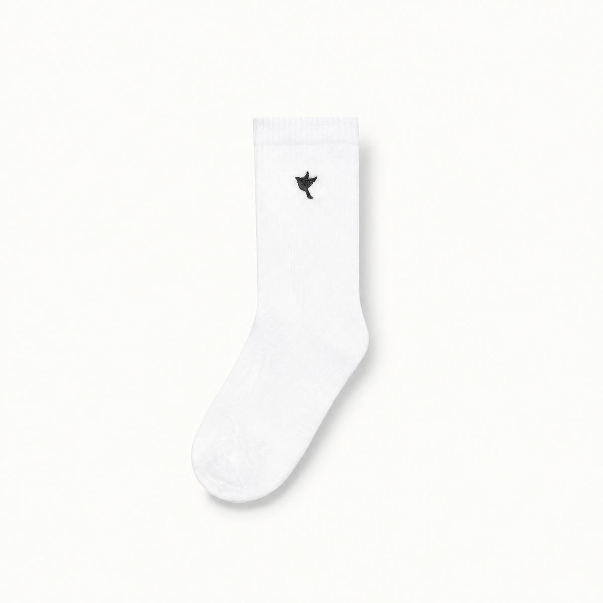 Dove socks — white / black — single product view on the Maison studio background.