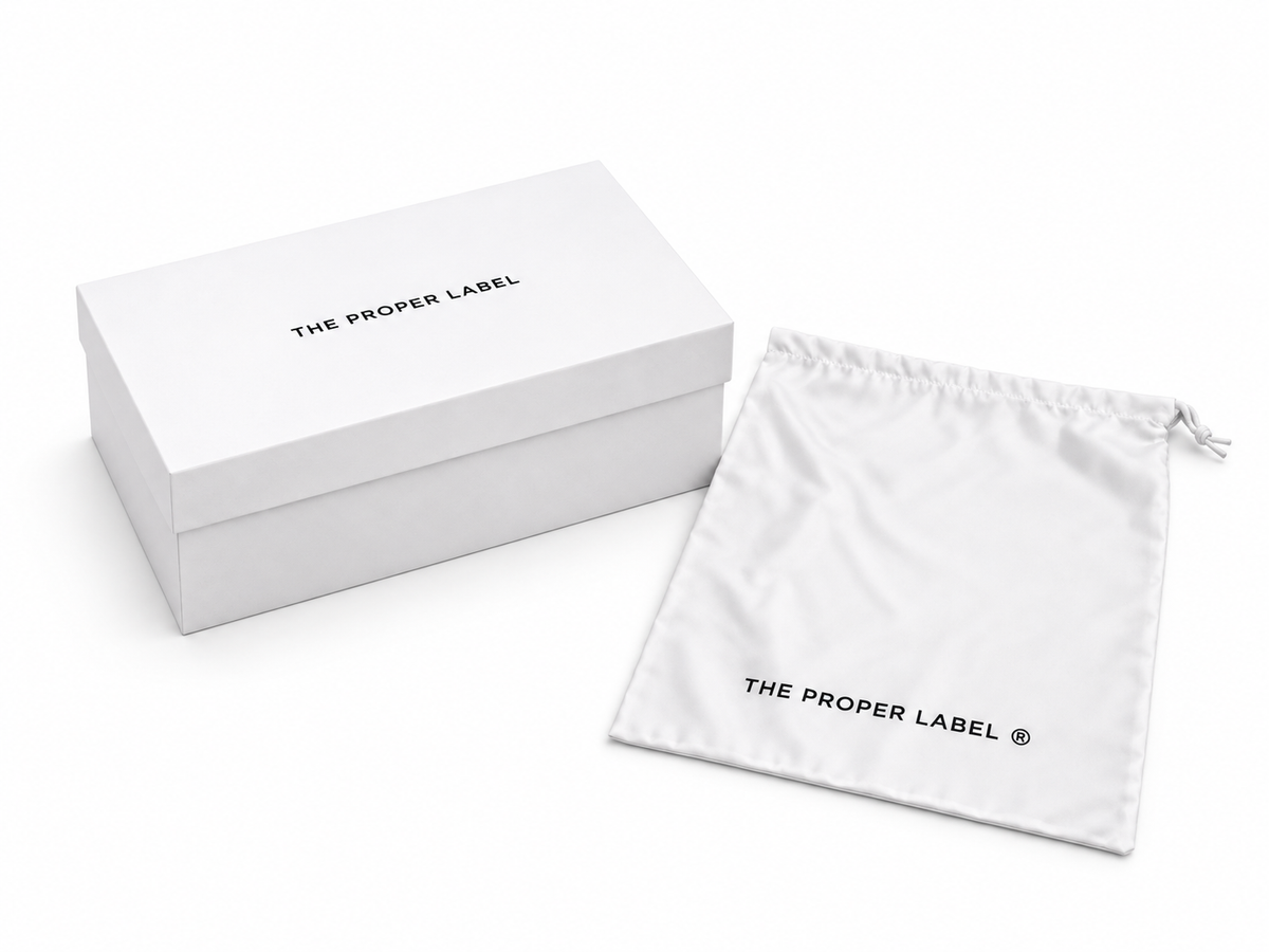 The Proper Label white shoe box and protective drawstring pouch.
