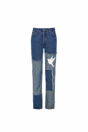 Patchwork denim trousers — single product view on the Maison studio background.