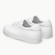 The Proper Sneaker® — white pair, heel panels and rear stitching.