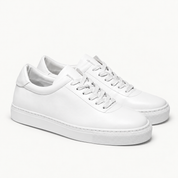 The Proper Sneaker® — white pair, front three-quarter view.